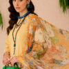 a woman in a yellow dress holding a green purse.